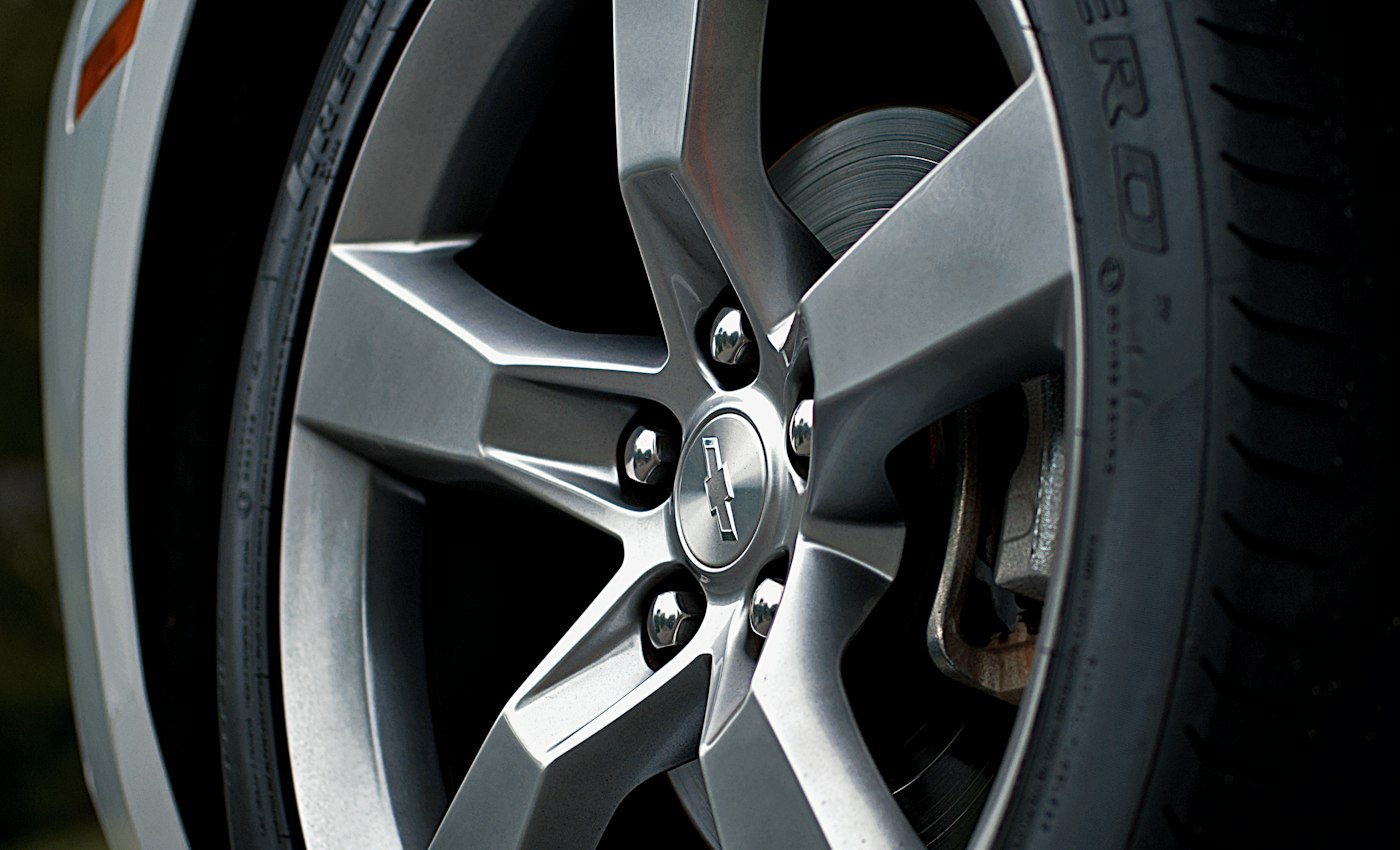 A close-up of a silver alloy wheel and tyre